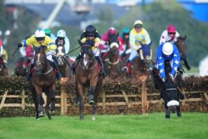 Listowel 18-9-14 PORTRADE & Andrew Lynch (Centre) jump the last to win the Ladbrokes Handicap Hurdle from MACNICHOLSON & Barry Geraghty (Left) & SMILER and Luke Dempsey (Right)(WWW.HEALYRACING.IE)